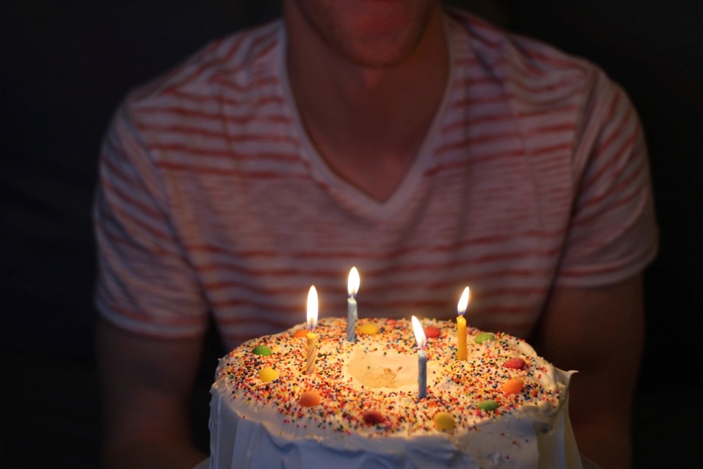 Birthday cake with lit candles