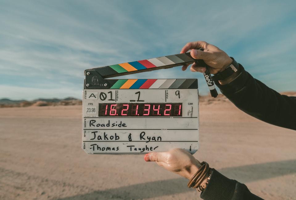 Clapperboard held up in the desert before a take